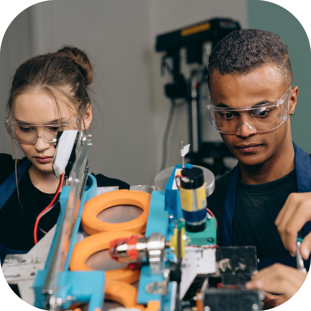 Image of two high school students using hands-on tools.
