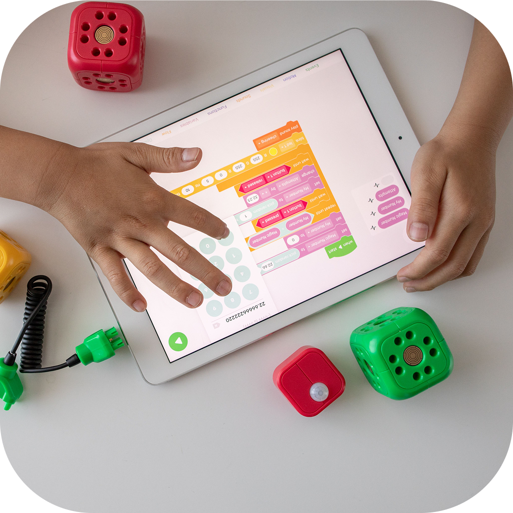 Image of a student using a programming app on a smart tablet.
