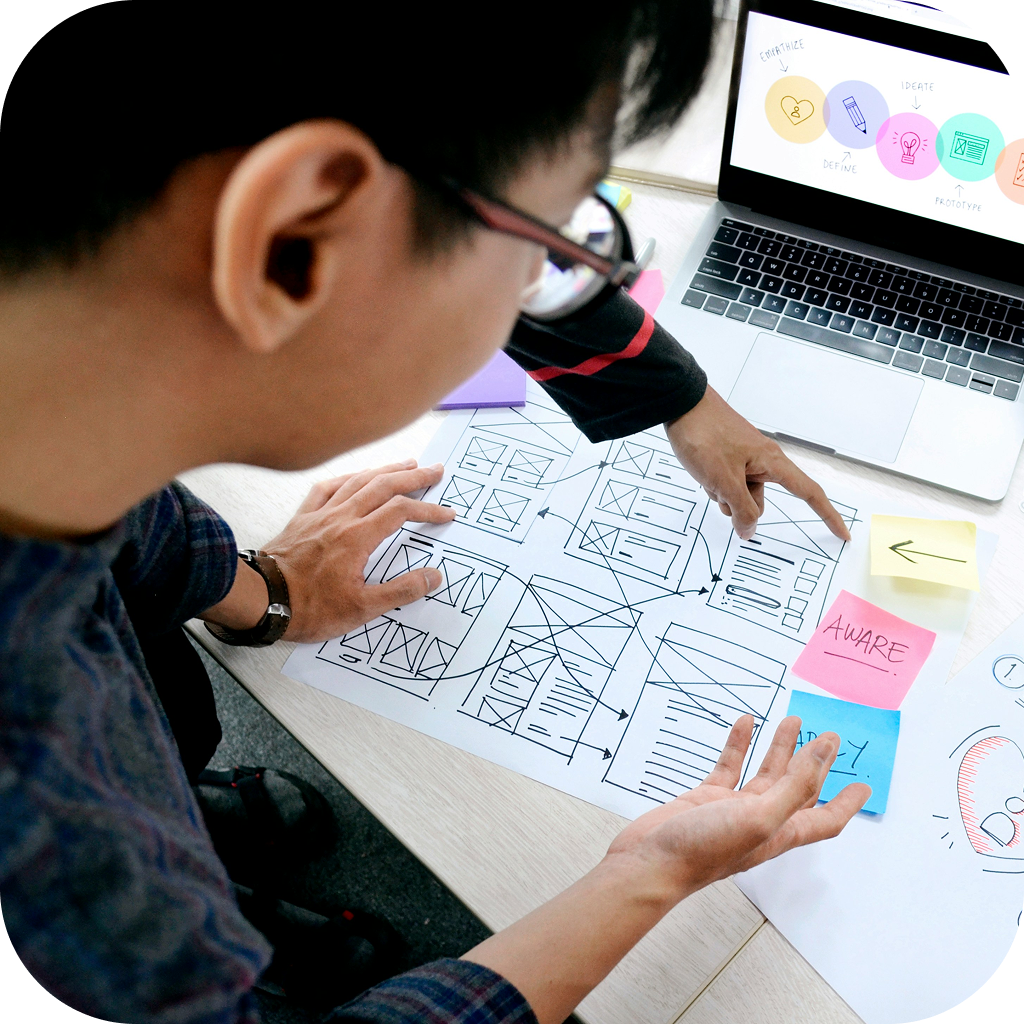 Image of an educator carefully mapping out an educational curriculum.
