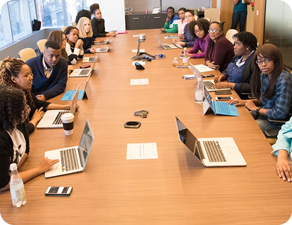 Image of a group of people around a conference table