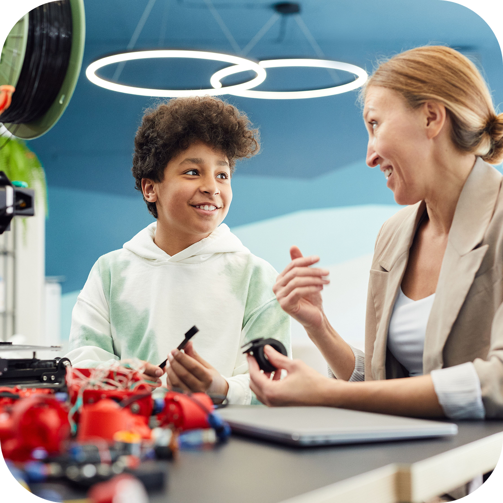 Image of a teacher and a student engaging in a STEM activity.