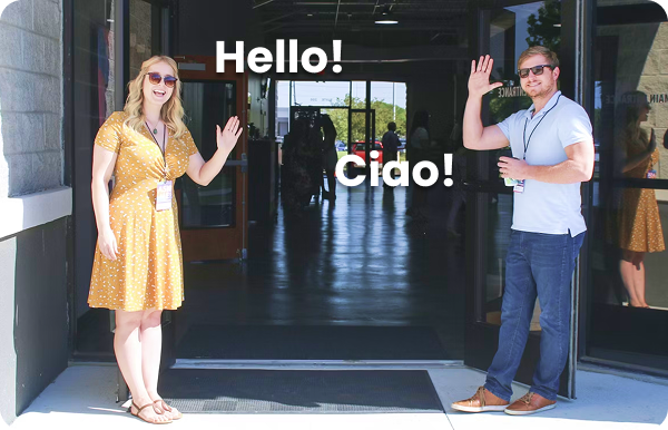 Photo of a two people saying hello